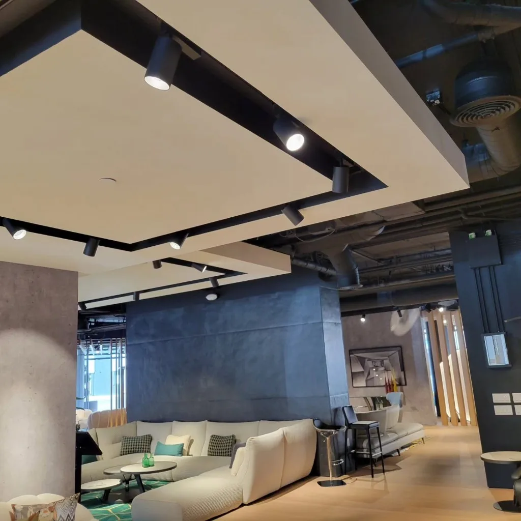 Modern commercial lounge with recessed track lighting